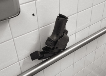 Johnson’s Police Oversight Nominee Left Loaded Gun in Airport Restroom