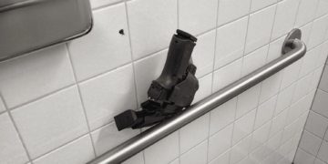 Johnson’s Police Oversight Nominee Left Loaded Gun in Airport Restroom
